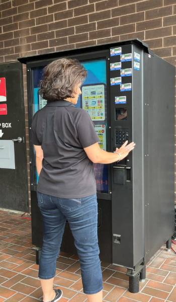 Image of person using the vending machine.